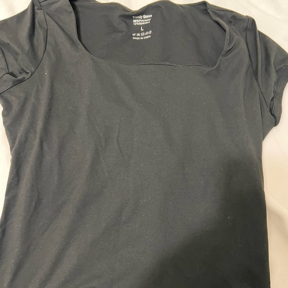 Never been worn, new condition, black tshirt size L